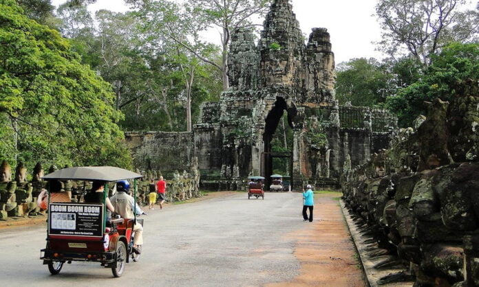 A tuk-tuk entering Angkor Thom on the Small Circuit tour
