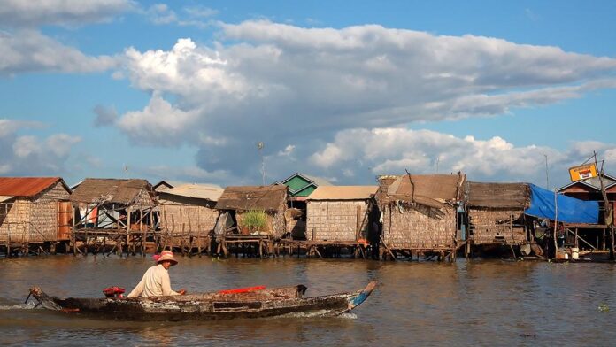 Exploring a floating village on Tonle Sap Lake by boat